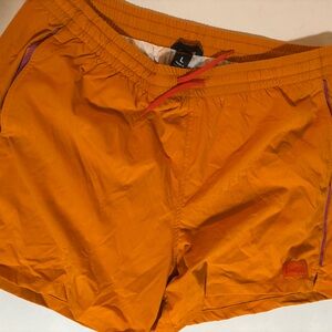 Cotopaxi Vibrant Orange Shorts with Purple Accents